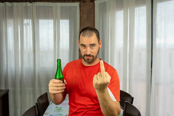 Bearded man and short hair in red shirt happy with a fresh beer. Fun concept