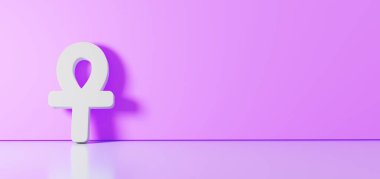 Ankh simgesinin 3d görüntülemesi sağ tarafında boş alan olan zemin yansıması ile renk duvarına yaslanıyor