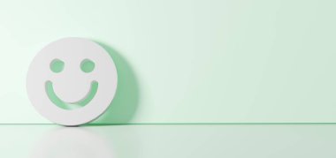 Simgelerin beyaz sembolünün 3D görüntülenmesi sağ tarafında boş alan olan yer yansıması ile renk duvarına dayanan gülümseme simgesi