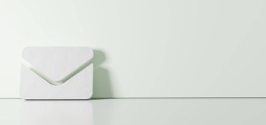 Zarf simgesinin üç boyutlu görüntülemesi sağ tarafında boş alan olan zemin yansıması ile renk duvarına dayanır