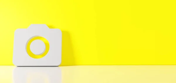 Renderização 3D do símbolo branco do ícone da câmera apoiada na parede de cores com reflexão no chão com espaço vazio no lado direito — Fotografia de Stock