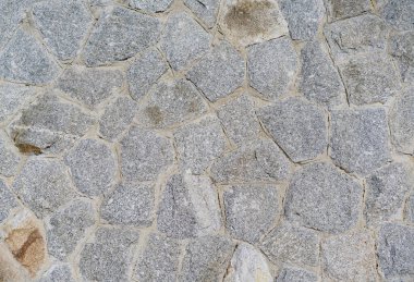 Taş bir duvarın dokusu. Eski kale taşından duvar dokusu. Bir taş duvarın parçası, arkaplan veya doku için