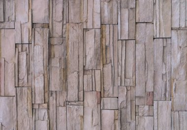 Taş bir duvarın dokusu. Eski kale taşından duvar dokusu. Bir taş duvarın parçası, arkaplan veya doku için