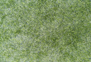 Yeşil yapay çimen dokusu arka plan olarak kullanılabilir.