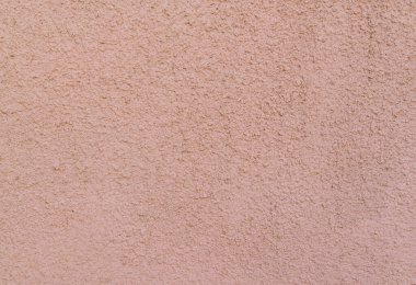 Bej duvar dokusu önde, spatula teknikleri ile bestelenmiş, arkaplan tasarımı.