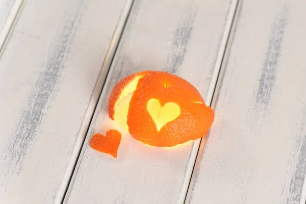 Cut out heart  from orange peel, love concept for Valentine's Day