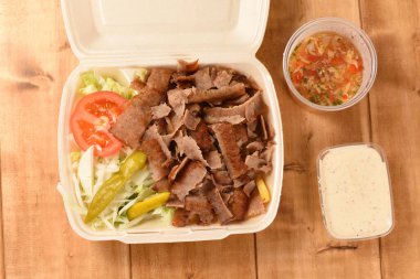 delivered fast food doner in a plastic box