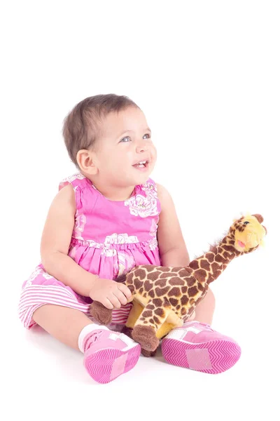 baby girl with toy giraffe