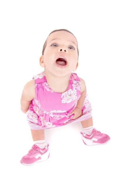 Meisje van de baby in roze jurk — Stockfoto