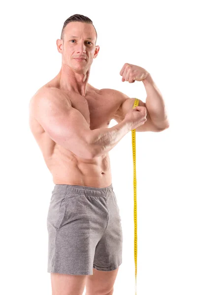 Homem muscular ajuste com centímetro — Fotografia de Stock