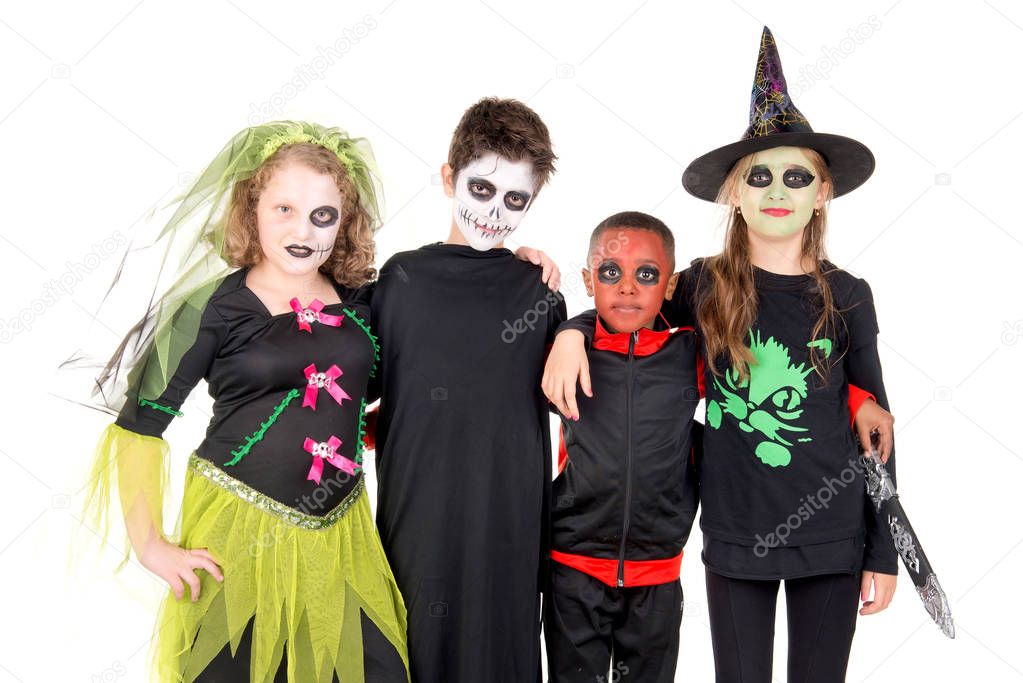 kids posing  in costumes for halloween 