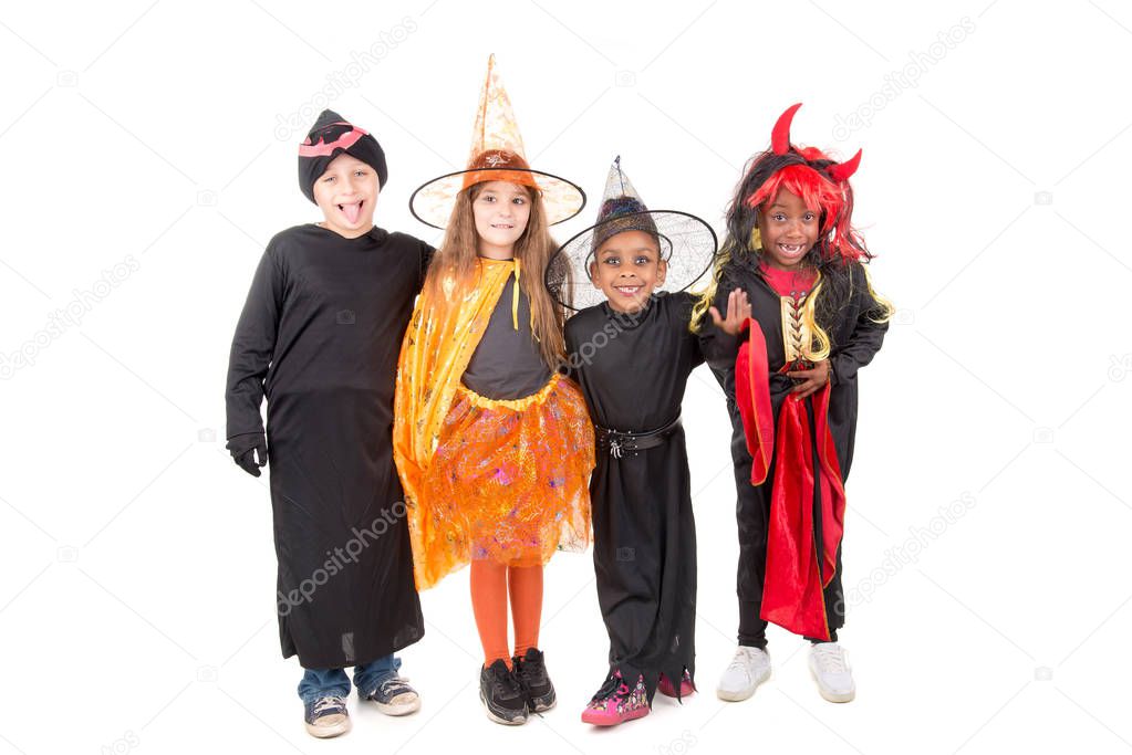 kids posing  in costumes for halloween