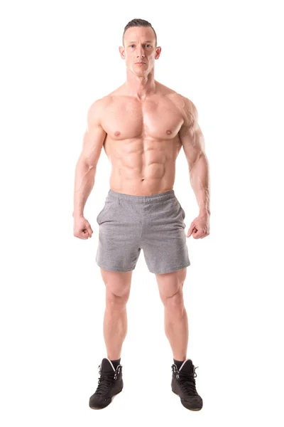 Fitness trainer showing muscles — Stock Photo, Image