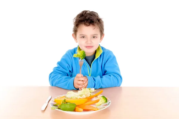 Sebze yiyen çocuk — Stockfoto