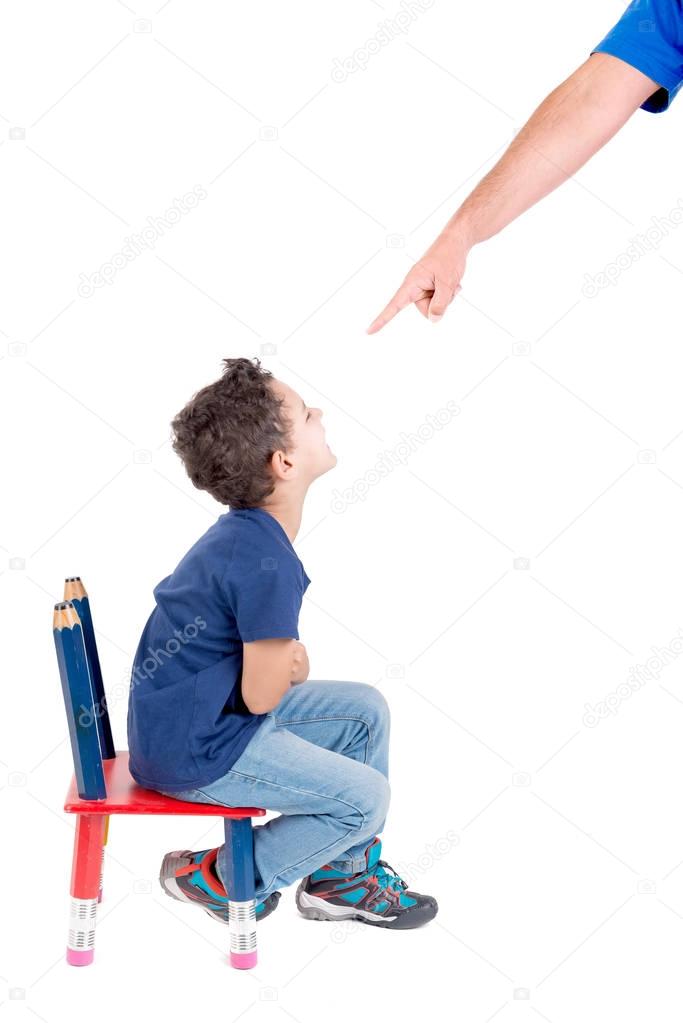 Person punishing little boy 