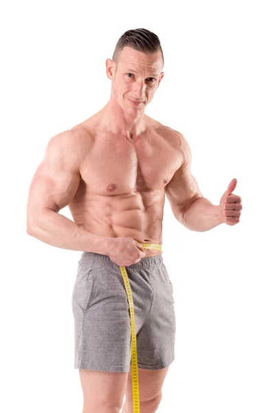 El hombre mide el espesor de los bíceps — Foto de Stock