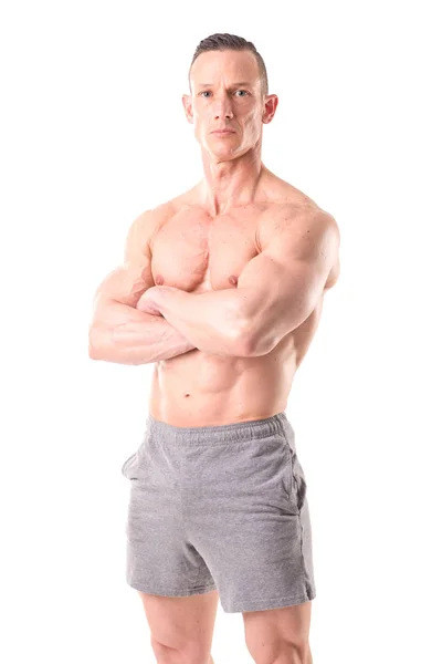 Fit muscular man posing isolated in white — Stock Photo, Image