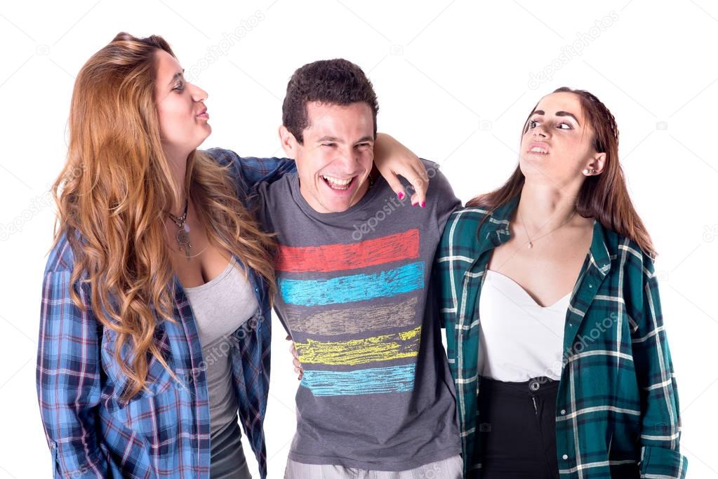 Group of young friends wearing casual clothes hugging and posing isolated on white background