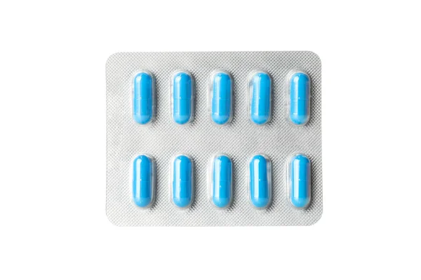 Blauwe capsules pillen in blisterverpakking geïsoleerd op witte achtergrond — Stockfoto