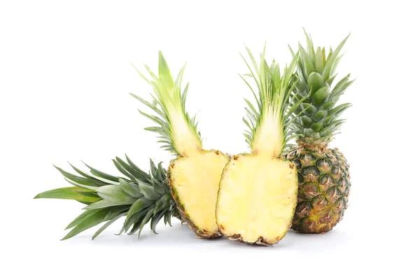 Pineapples and two halves isolated on white background. Juicy fr — Stock Photo, Image