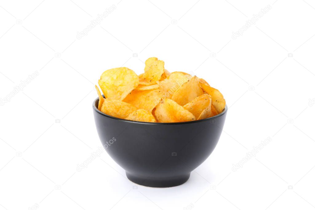 Potato chips in a black bowl isolated on white background, space