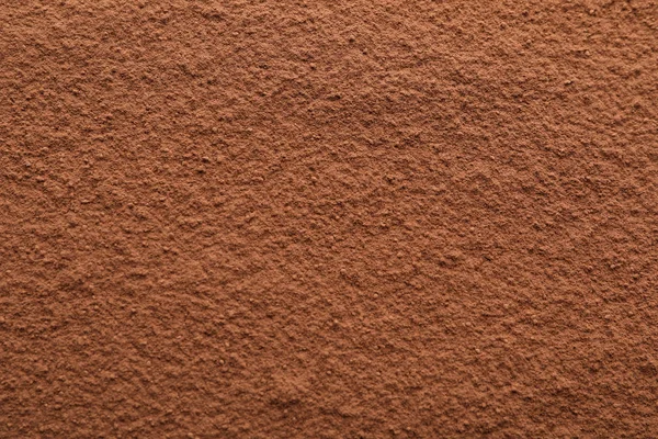 Kakaopulver strukturierter Hintergrund, Nahaufnahme und Platz für Text — Stockfoto