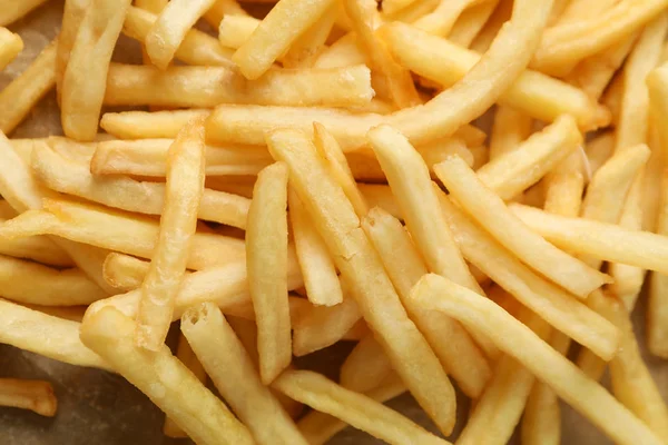 Saboroso francês batatas fritas textura close-up, vista superior — Fotografia de Stock