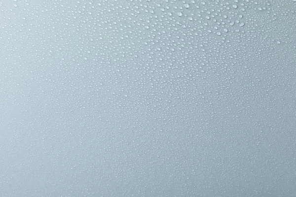 Muchas gotas de agua sobre fondo gris. Textura fondo, cerca u — Foto de Stock