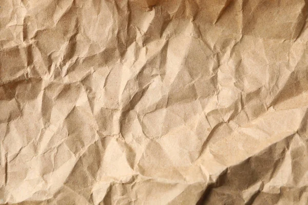 Crumpled artesanato fundo textura de papel, close-up — Fotografia de Stock