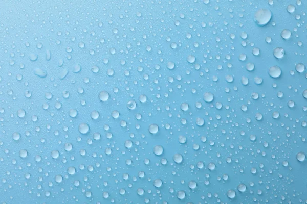 Mavi arka planda çok su damlası var. Doku arkaplanı.