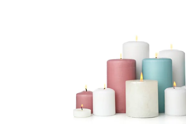 Grupo de diferentes velas aisladas sobre fondo blanco — Foto de Stock