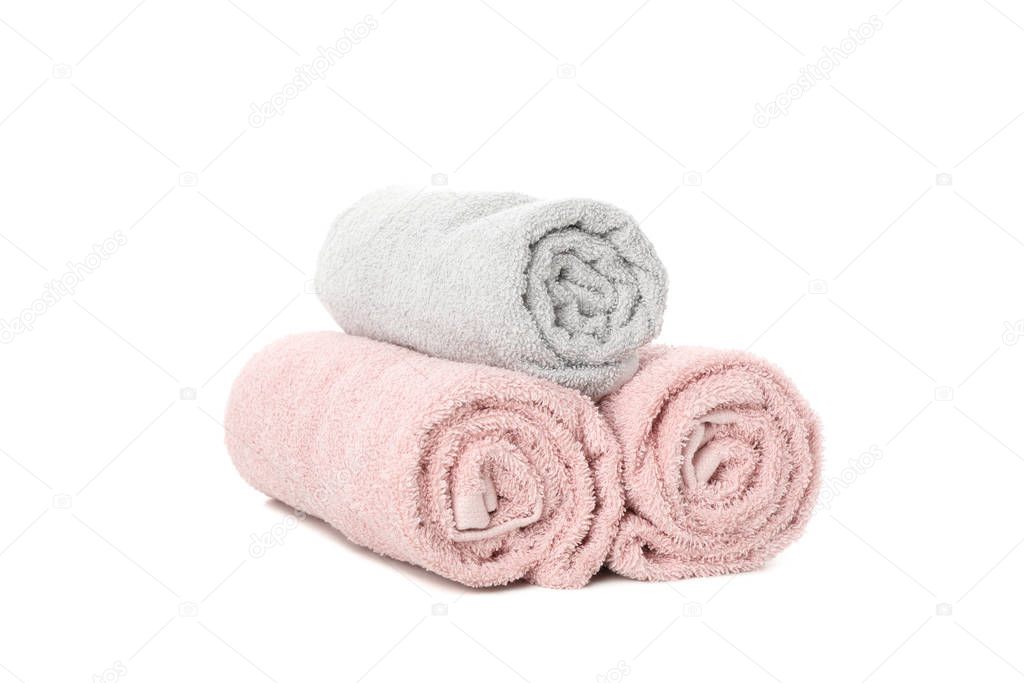 Rolled color towels isolated on white background, close up