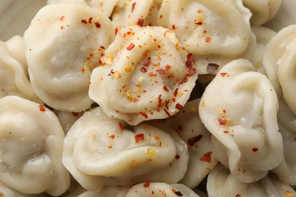 Dumplings with spices texture background, close up — Stock Photo, Image