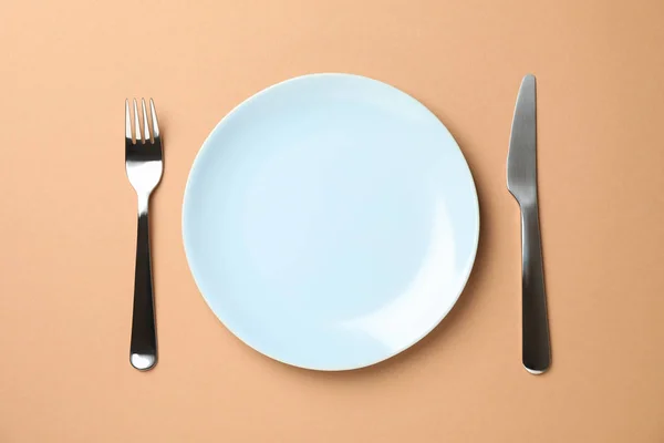 Table setting. Plate, fork and knife on craft background, top vi — 스톡 사진