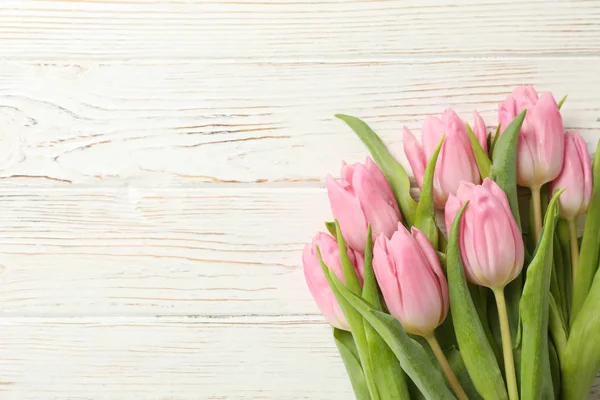 Beautiful tulips on wooden background, space for text — Stock Photo, Image