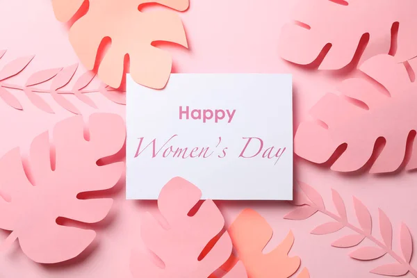 Hojas de palma decorativas e inscripción Feliz día de la mujer en colo —  Fotos de Stock