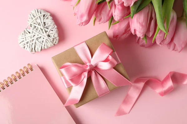 Tulips, gift, hearts and copybook on pink background, close up — 스톡 사진