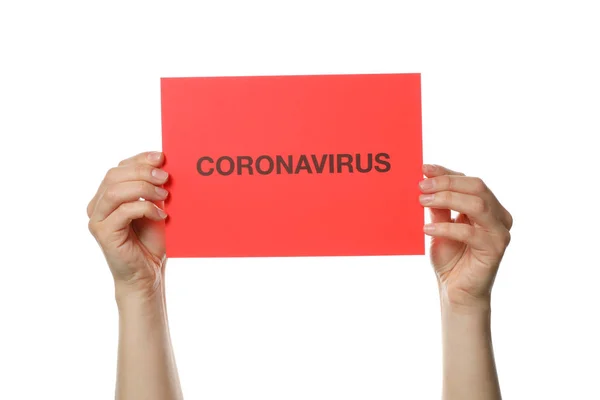 The hand holds the inscription "Coronavirus" isolated on white b — 스톡 사진