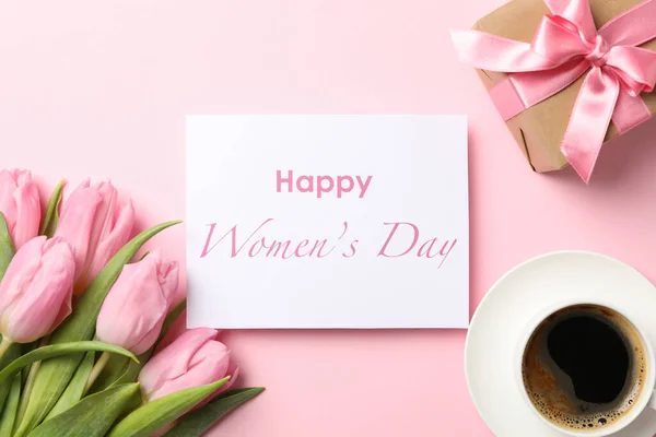 Pink tulips, cup of coffee and inscription Happy women's day on — Stock Photo, Image