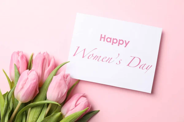 Pink tulips and inscription Happy women's day on pink background — Stock Photo, Image