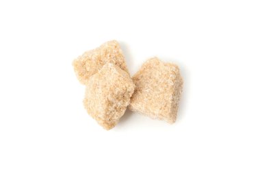 Brown sugar slices isolated on white background, close up
