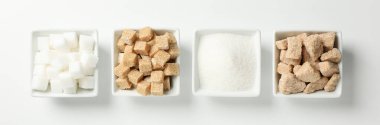 Square bowls with sugar on white background, top view
