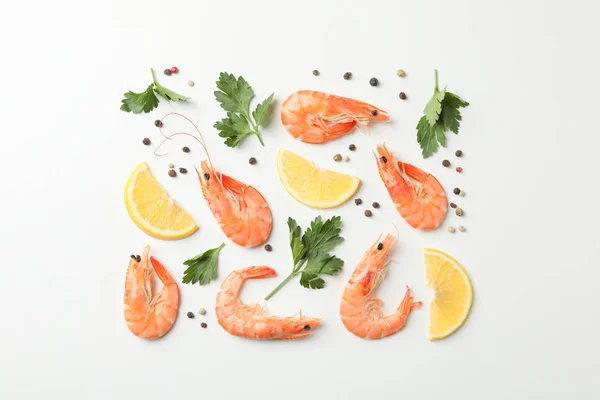 Flat lay with shrimps and spices on white background, top view — 스톡 사진