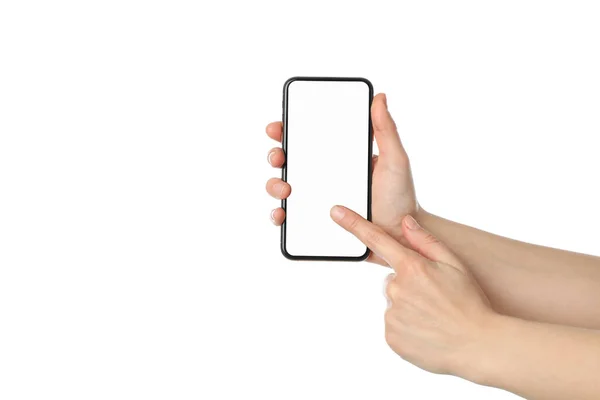 Manos femeninas sosteniendo el teléfono con pantalla vacía, aisladas en blanco — Foto de Stock