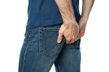 Man holding his butt, isolated on white background