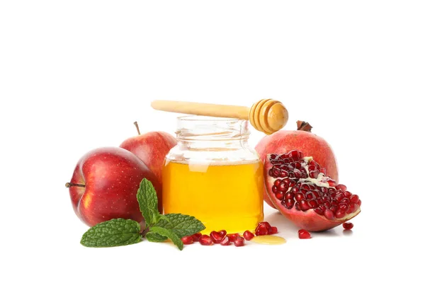Beyaz arka planda izole edilmiş elma, nar ve bal. Doğal tedavi