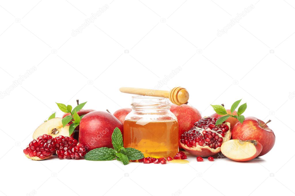 Apples, pomegranate, mint and honey isolated on white background. Natural treatment