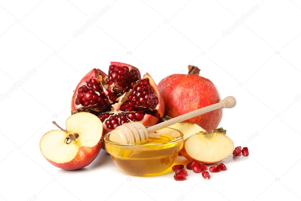 Apples, pomegranate and honey isolated on white background. Natural treatment
