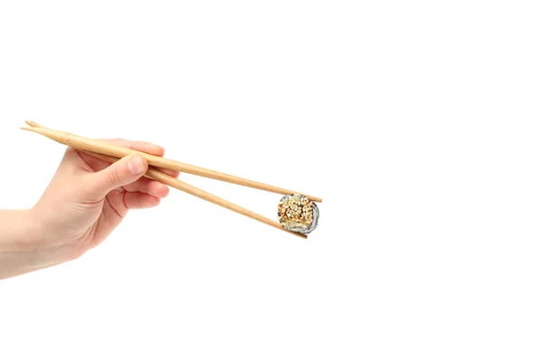 拿着筷子的女手拿着寿司卷 与白色背景隔离 — 图库照片