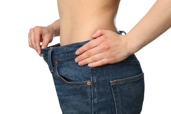 Meisje Trekken Haar Grote Jeans Het Tonen Van Gewichtsverlies Geïsoleerd — Stockfoto